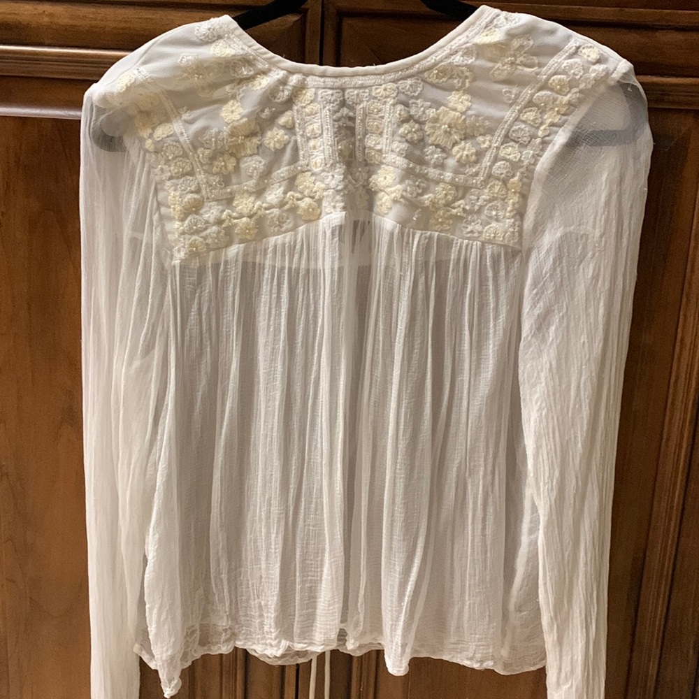 FREE PEOPLE long sleeve silky blouse. Embroidered and beaded front.